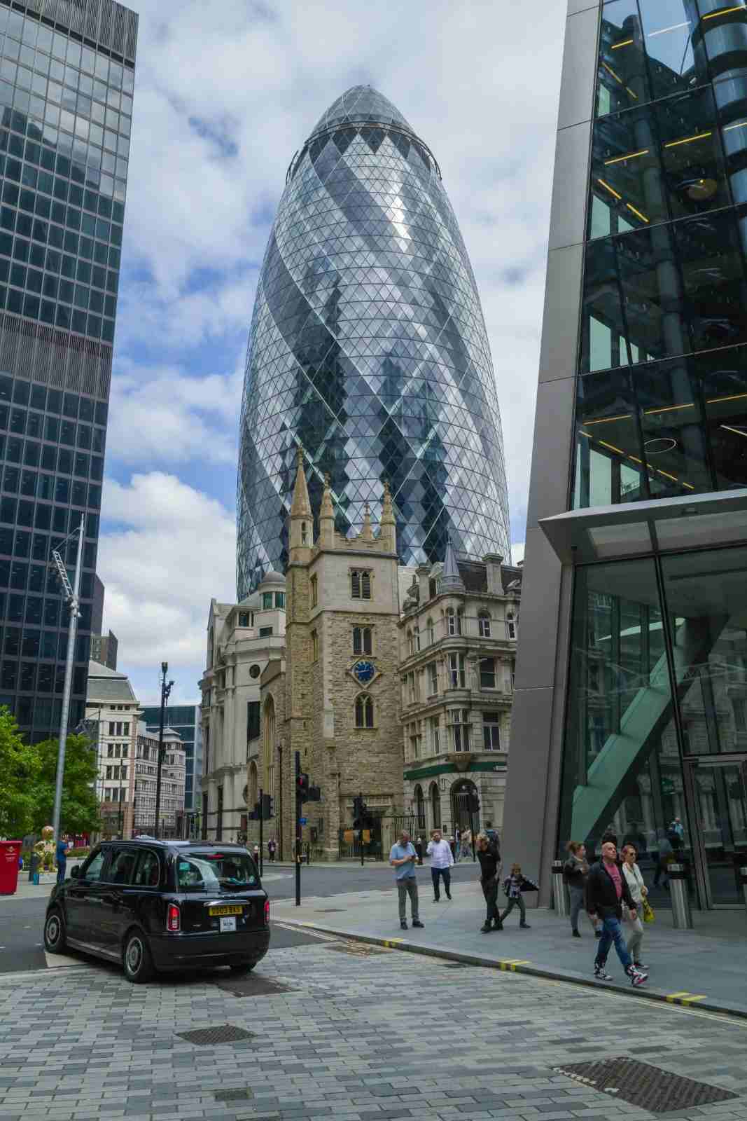 Modern skyscraper beside historic building